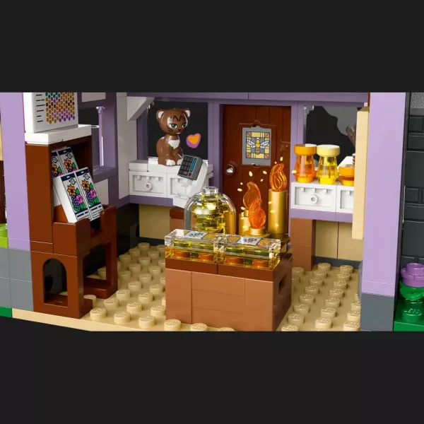 Конструктор LEGO Friends Будиночок і квітник бджолярів (42669)